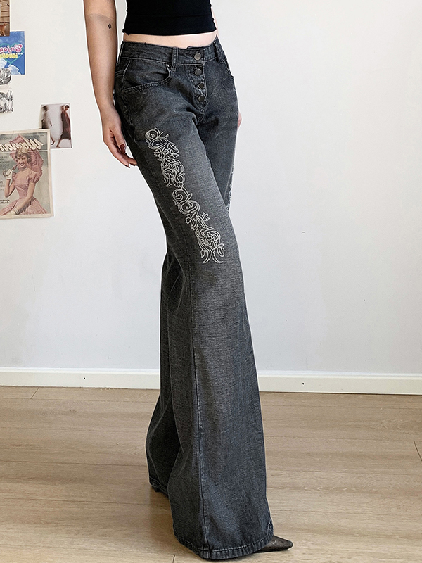 Schlagjeans mit Vintage-Print und Waschung