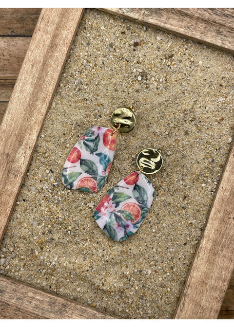 Orange tryckta örhängen med hänge